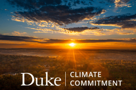 Duke Climate Commitment wordmark over aerial pic of sunrise over forest